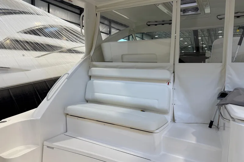 Slide: The Image of 2023 Tiara Yachts 43 Open interior with white seating and modern design. - 5