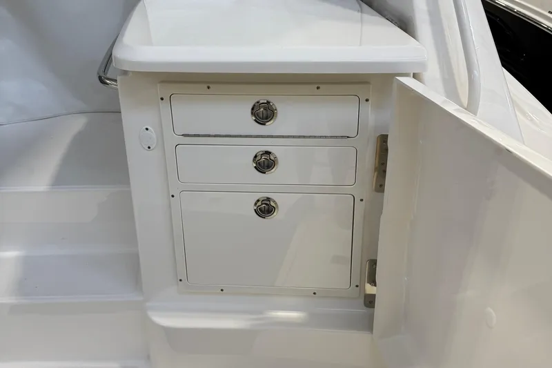 Slide: The Image of 2023 Tiara Yachts 43 Open interior storage drawers with sleek design. - 7