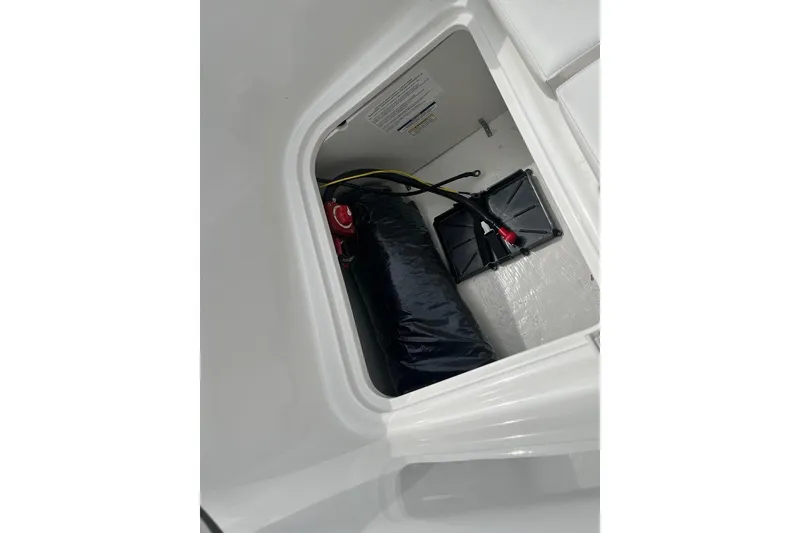 Slide: The Image of View inside storage compartment of 2026 Bayliner Element E16 boat. - 17