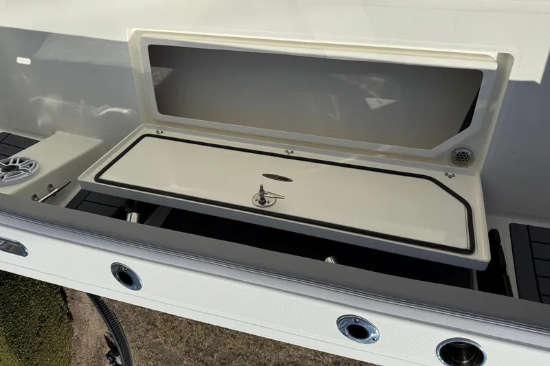 Slide: The Image of 2026 Pathfinder 2400 Open boat storage compartment with open lid, showcasing interior features. - 10