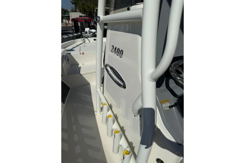 Slide: The Image of 2026 Pathfinder 2400 Open boat interior with rod holders and steering console. - 19