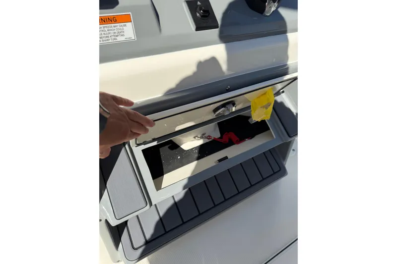 Slide: The Image of Open storage compartment on 2026 Pathfinder 2400 Open boat, showing interior details. - 23