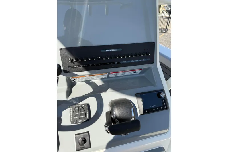 Slide: The Image of 2026 Pathfinder 2400 Open boat dashboard with controls and display panel. - 25