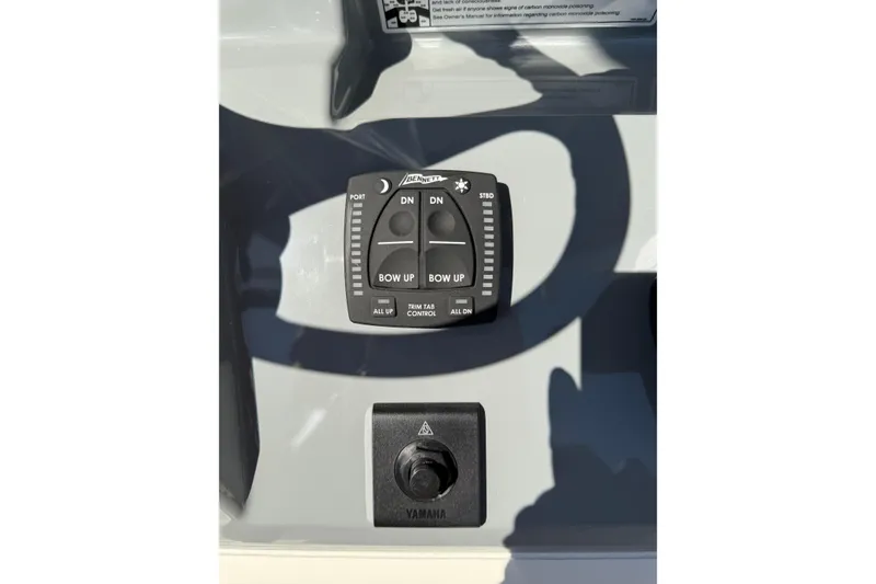 Slide: The Image of Control panel of 2026 Pathfinder 2400 Open boat with trim tab and Yamaha switch. - 27