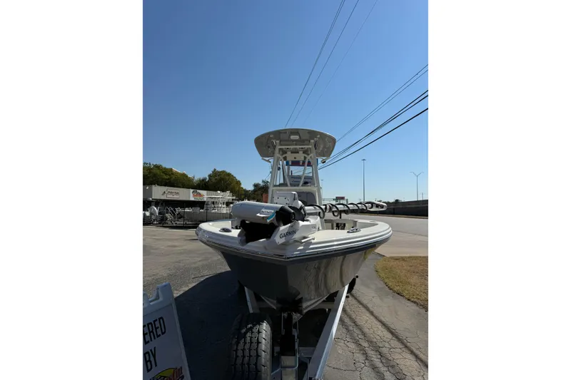 Slide: The Image of 2026 Pathfinder 2400 Open boat on trailer, clear sky background. - 3