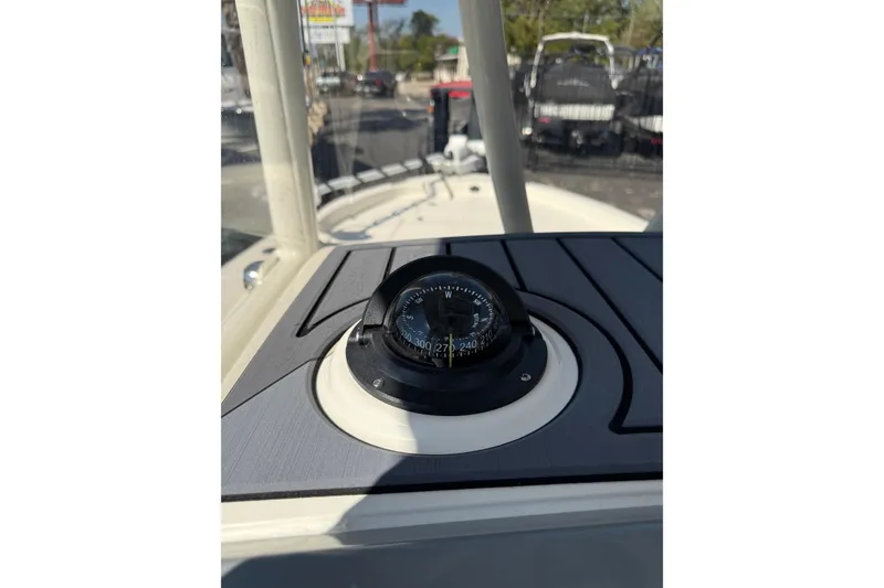 Slide: The Image of Compass on 2026 Pathfinder 2400 Open boat dashboard in outdoor setting. - 31