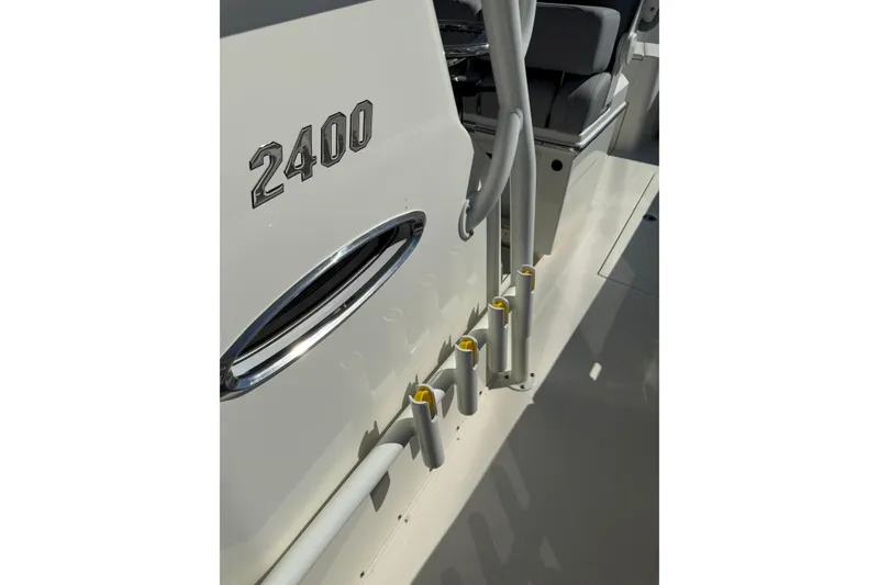 Slide: The Image of 2026 Pathfinder 2400 Open boat detail with rod holders and seating area. - 34