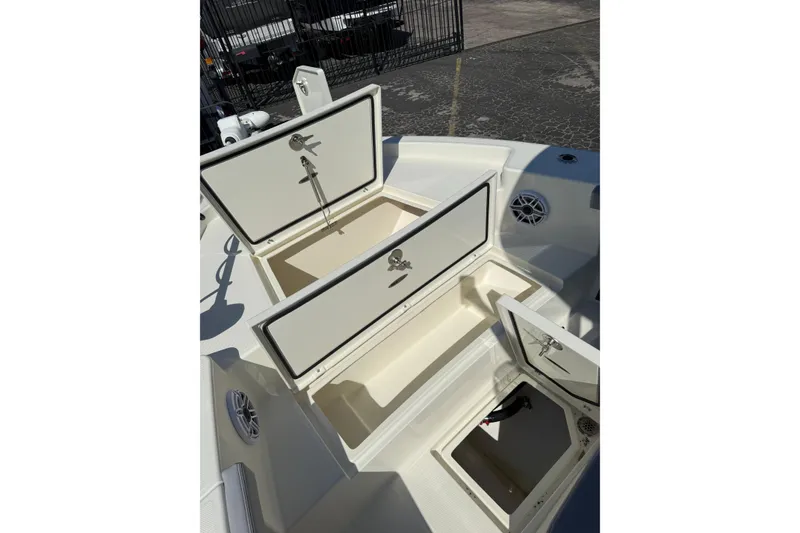 Slide: The Image of 2026 Pathfinder 2400 Open boat storage compartments with open hatches. - 39