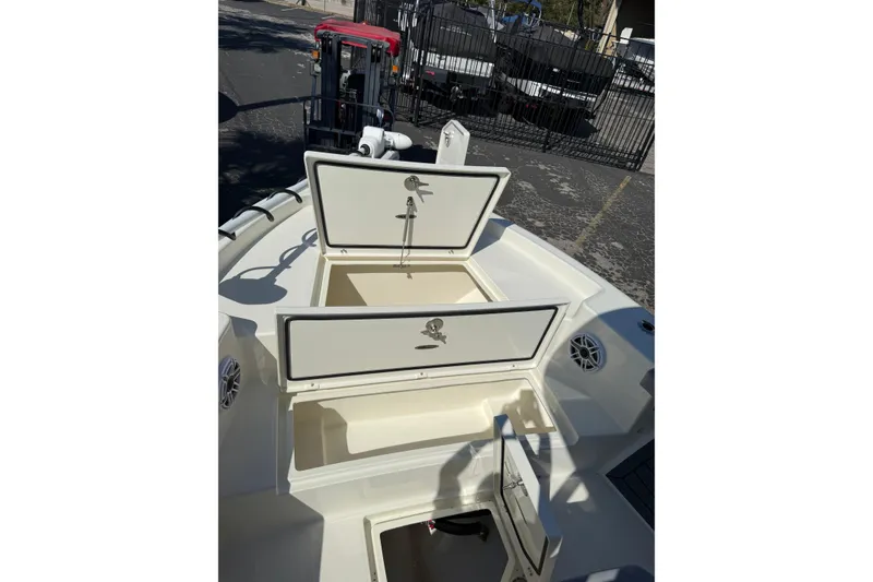 Slide: The Image of 2026 Pathfinder 2400 Open boat with open storage compartments on deck. - 40