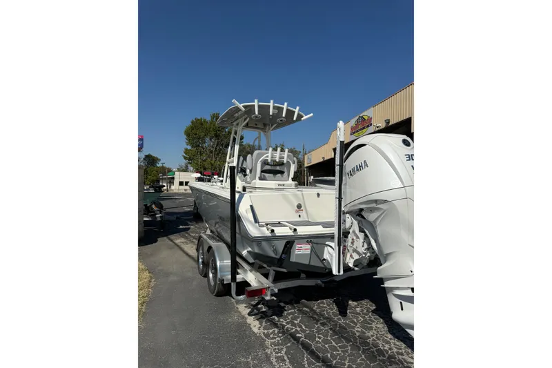 Slide: The Image of 2026 Pathfinder 2400 Open boat with Yamaha engine on trailer, outdoor display. - 49