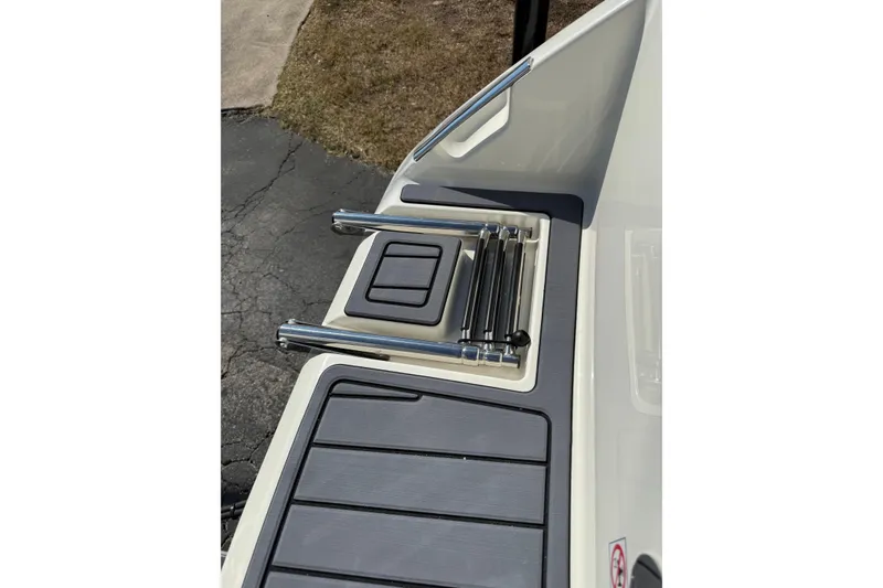 Slide: The Image of 2026 Pathfinder 2400 Open boat deck with retractable ladder and non-slip surface. - 5