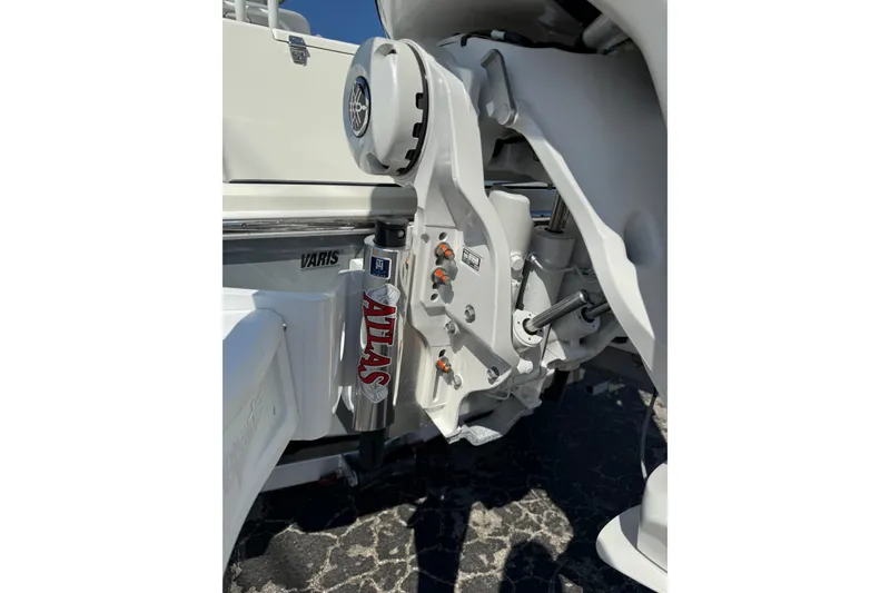 Slide: The Image of 2026 Pathfinder 2400 Open boat engine detail with Atlas hydraulic jack plate. - 50