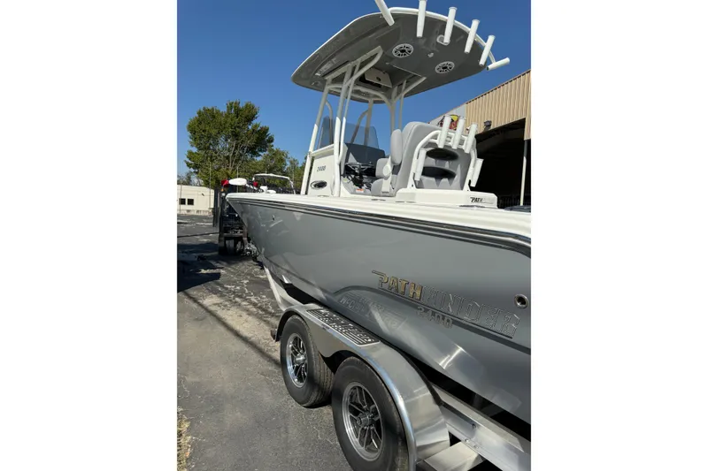Slide: The Image of 2026 Pathfinder 2400 Open boat on trailer, parked outdoors. - 52