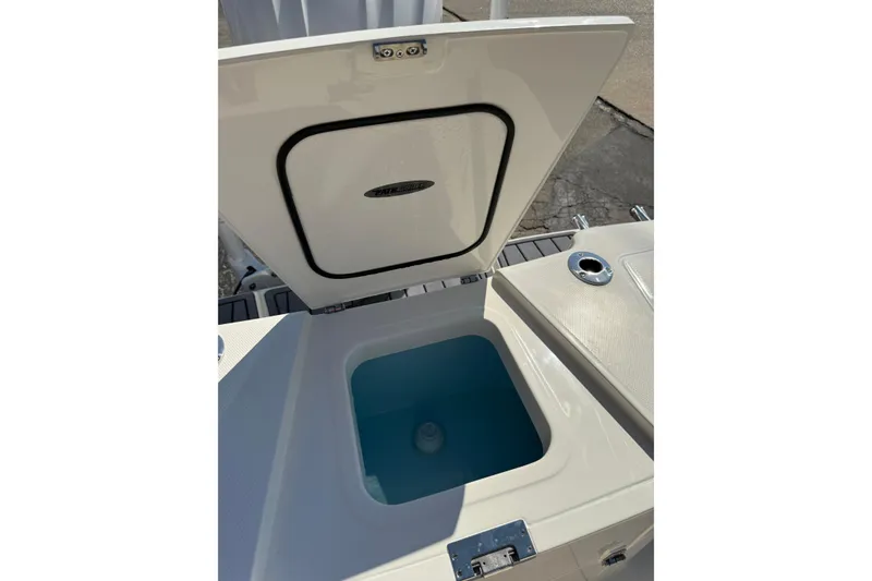 Slide: The Image of Open storage compartment on 2026 Pathfinder 2400 Open boat, showcasing interior design. - 8