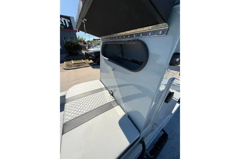 Slide: The Image of 2026 Freedom Boats 24 Defender interior seating detail in outdoor setting. - 6