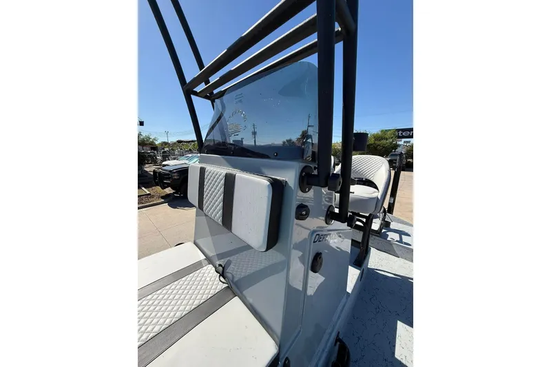 Slide: The Image of 2026 Freedom Boats 24 Defender console with seating, showcasing sleek design and functionality. - 7