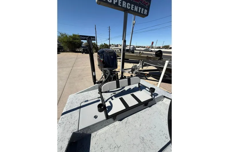 Slide: The Image of 2026 Freedom Boats 24 Defender with outboard motor at dealership. - 10