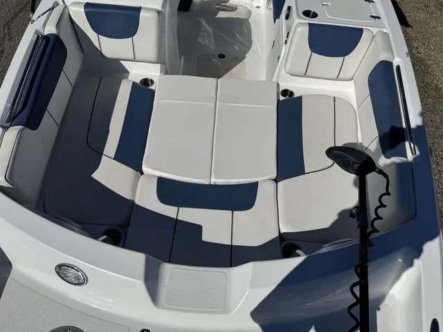Slide: The Image of 2020 Tahoe 2150 boat interior with white and blue seating arrangement. - 21