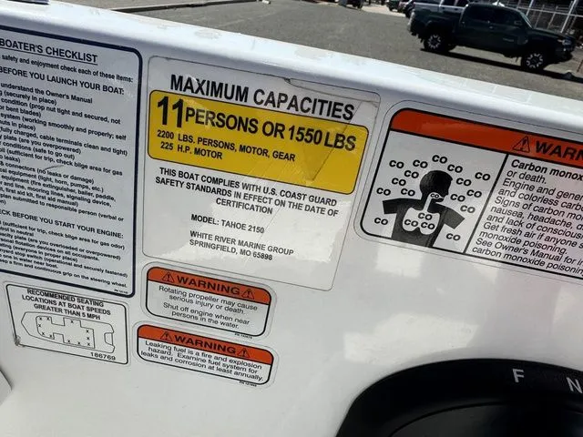 Slide: The Image of Boat capacity label for Tahoe 2150, 2020 model, showing maximum 11 persons or 1550 lbs. - 25