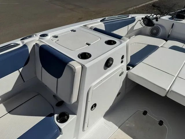 Slide: The Image of Interior of 2020 Tahoe 2150 boat with white and blue seating and storage compartments. - 30