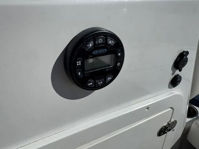 Slide: The Image of Control panel on 2020 Tahoe 2150 boat dashboard with Jensen audio system. - 31