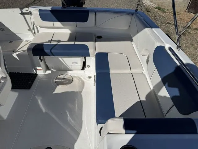 Slide: The Image of 2020 Tahoe 2150 boat interior with blue and white seating arrangement. - 33