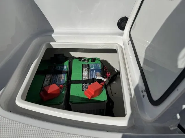 Slide: The Image of Boat battery compartment in a 2020 Tahoe 2150, featuring dual green batteries. - 45