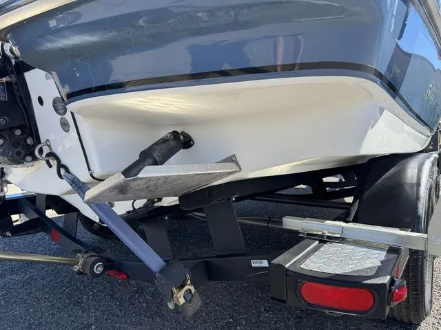 Slide: The Image of 2020 Tahoe 2150 boat on trailer, rear view showing hull and trailer details. - 6