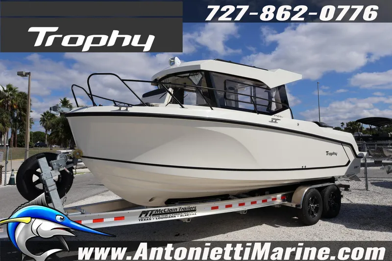 Slide: The Image of 2025 Trophy T 25 Pilothouse boat on trailer at Antonietti Marine dealership. - 1