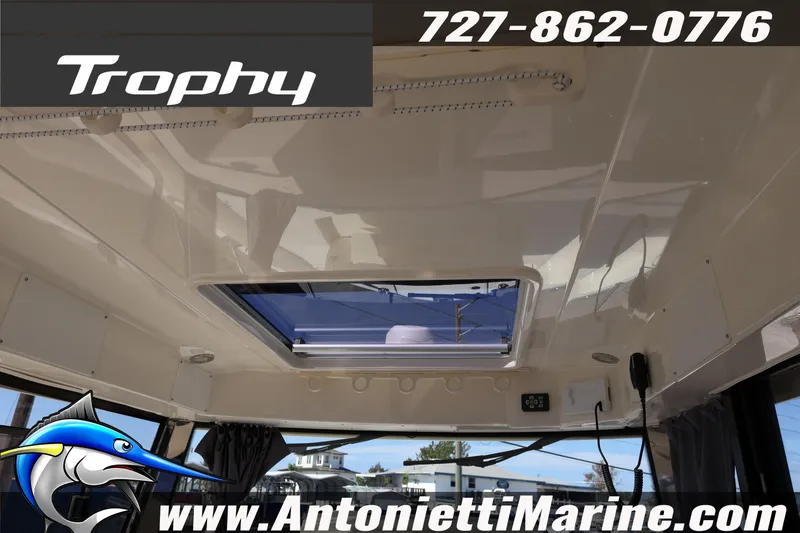 Slide: The Image of 2025 Trophy T 25 Pilothouse interior with skylight, featuring Antonietti Marine branding. - 12