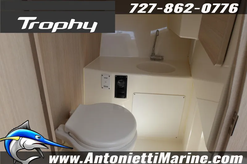 Slide: The Image of 2025 Trophy T 25 Pilothouse boat bathroom interior with sink and toilet. - 14