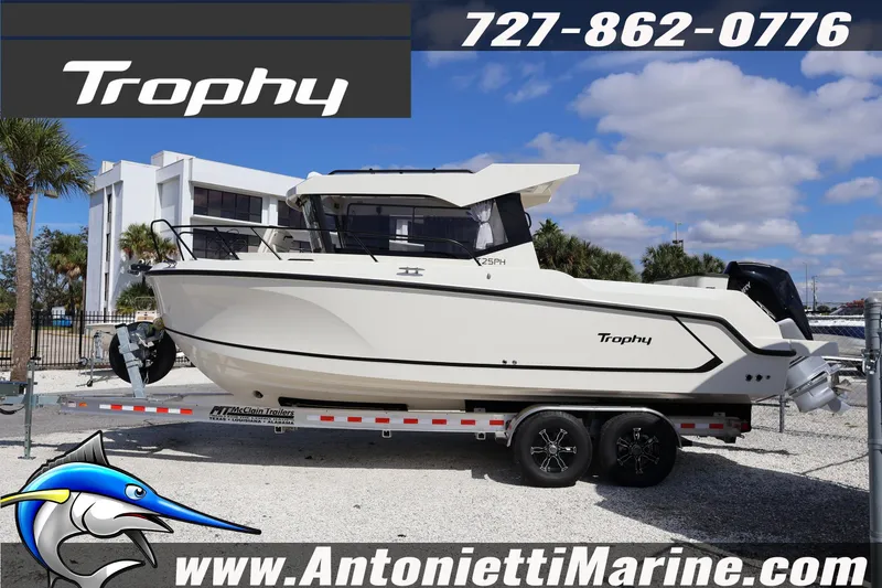 Slide: The Image of 2025 Trophy T 25 Pilothouse boat on trailer at Antonietti Marine dealership. - 2