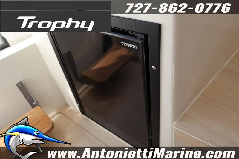 Slide: The Image of 2025 Trophy T 25 Pilothouse interior with Vitrifrigo fridge, Antonietti Marine branding. - 22