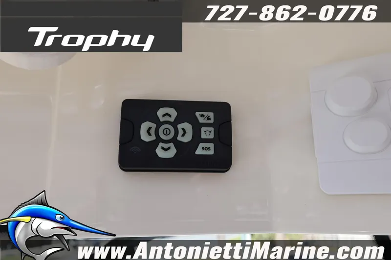 Slide: The Image of Remote control panel on 2025 Trophy T 25 Pilothouse boat dashboard. - 25