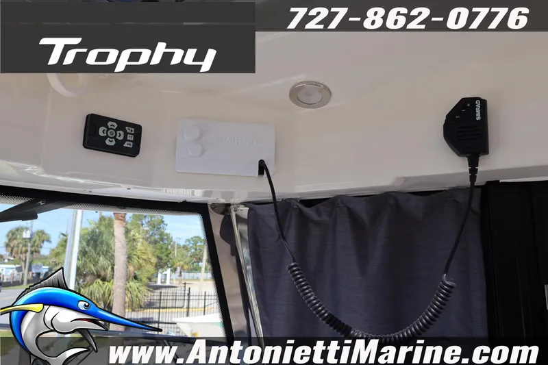 Slide: The Image of 2025 Trophy T 25 Pilothouse interior with Simrad electronics and marine equipment. - 26