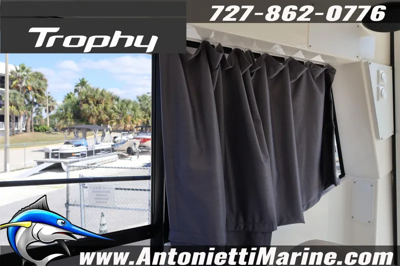 Slide: The Image of 2025 Trophy T 25 Pilothouse interior with curtain, showcasing Antonietti Marine branding. - 27