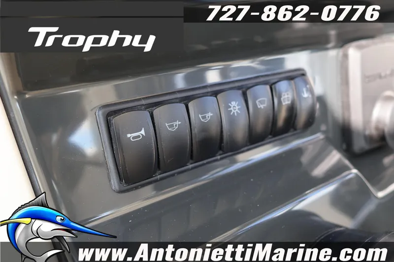 Slide: The Image of Control panel of 2025 Trophy T 25 Pilothouse boat with various switches. - 31