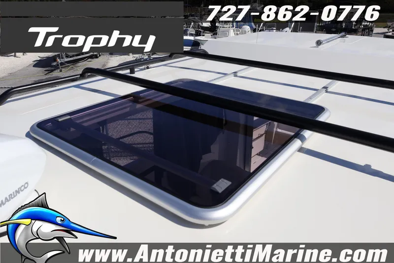 Slide: The Image of 2025 Trophy T 25 Pilothouse boat roof with hatch, contact info, and website. - 37