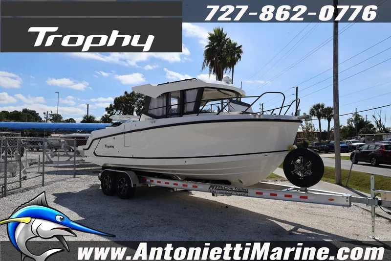 Slide: The Image of 2025 Trophy T 25 Pilothouse boat on trailer at Antonietti Marine dealership. - 4