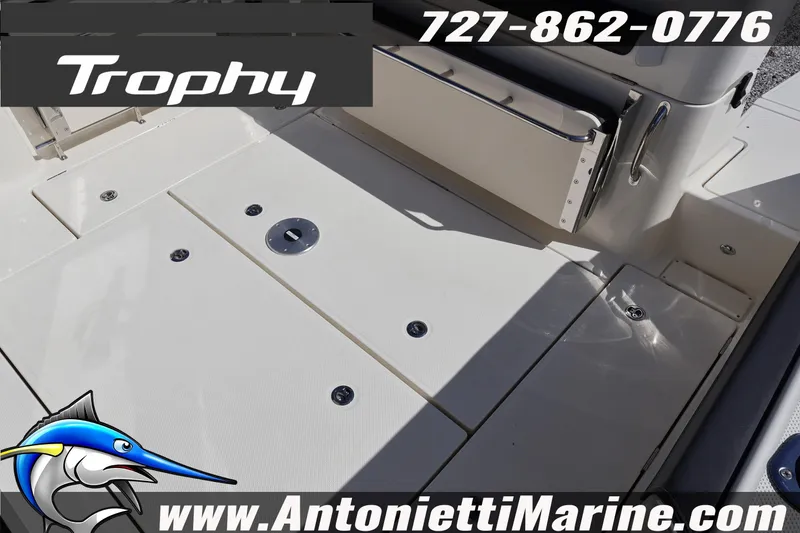 Slide: The Image of 2025 Trophy T 25 Pilothouse boat deck with seating, contact details, and logo. - 47