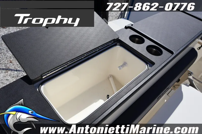 Slide: The Image of 2025 Trophy T 25 Pilothouse boat interior with storage and cup holders, Antonietti Marine branding. - 48
