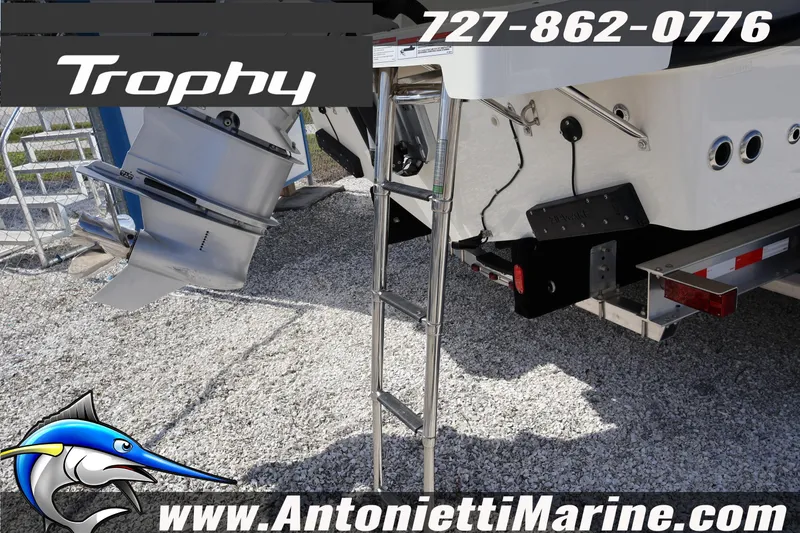 Slide: The Image of 2025 Trophy T 25 Pilothouse boat with ladder and outboard motor, Antonietti Marine branding. - 58