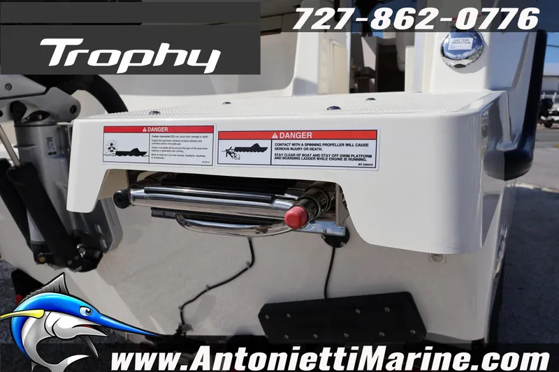 Slide: The Image of 2025 Trophy T 25 Pilothouse boat stern with safety warning and contact information. - 59