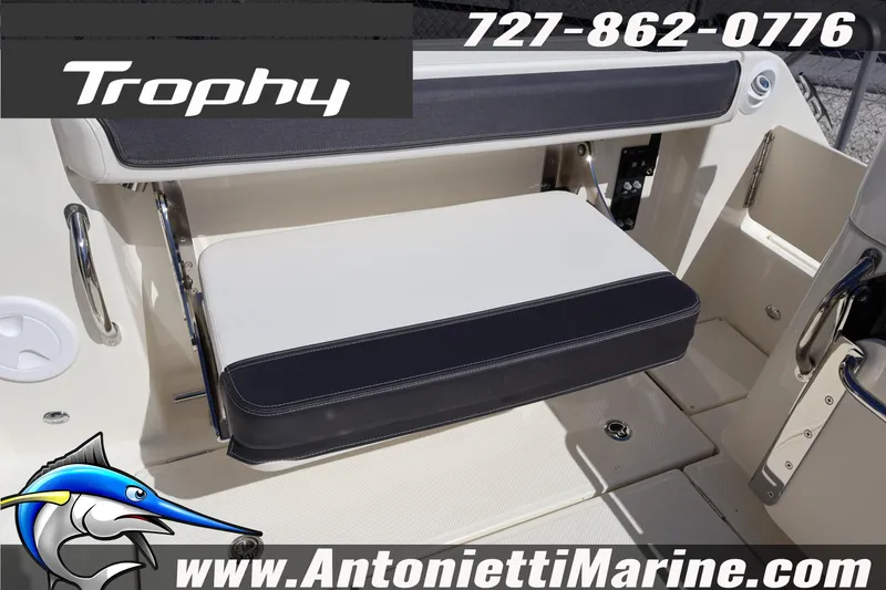 Slide: The Image of 2025 Trophy T 25 Pilothouse boat seating, featuring foldable bench and marine accessories. - 9