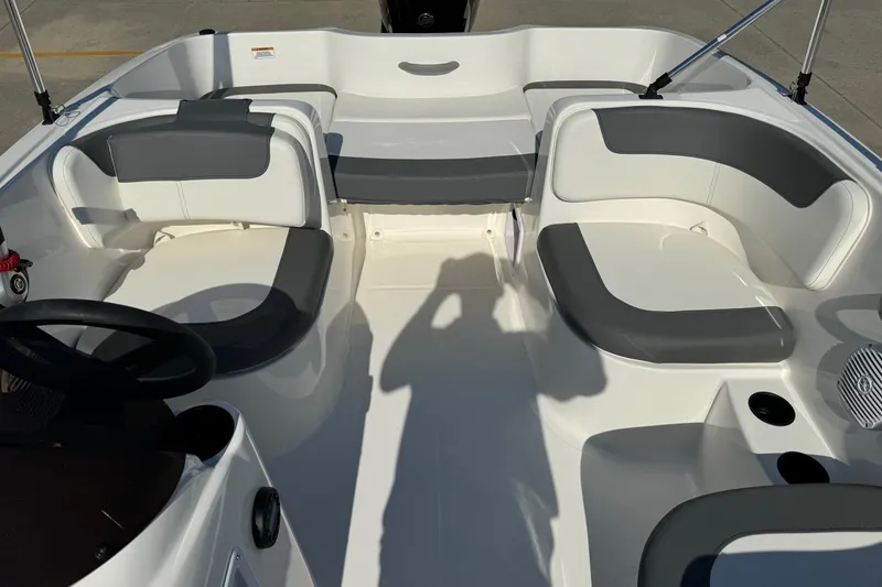 Slide: The Image of 2025 Bayliner Element E16 boat interior with gray and white seating arrangement. - 8