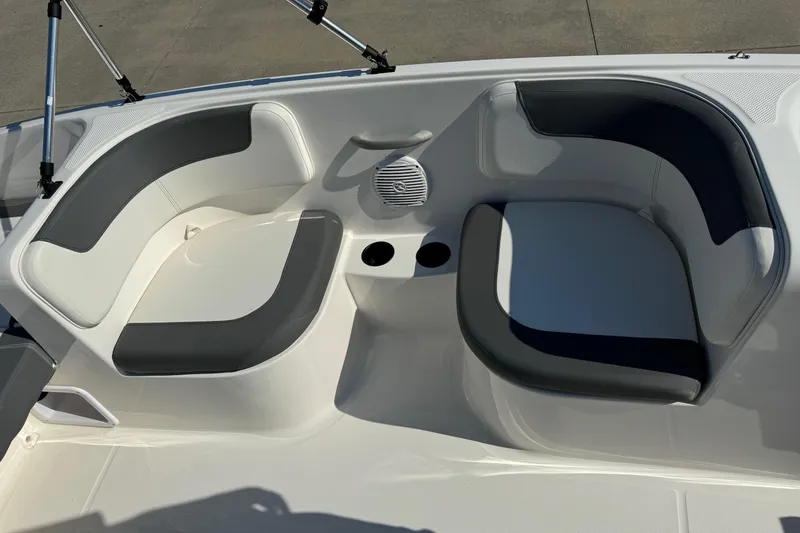 Slide: The Image of 2025 Bayliner Element E16 boat seating area with cup holders and speaker. - 9