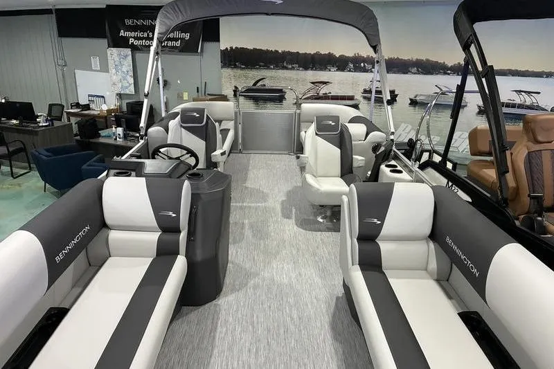 Slide: The Image of 2026 Bennington SX 22 SLX pontoon boat interior with plush seating and modern design. - 3