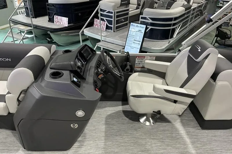 Slide: The Image of 2026 Bennington SX 22 SLX boat interior with modern helm and comfortable seating. - 4