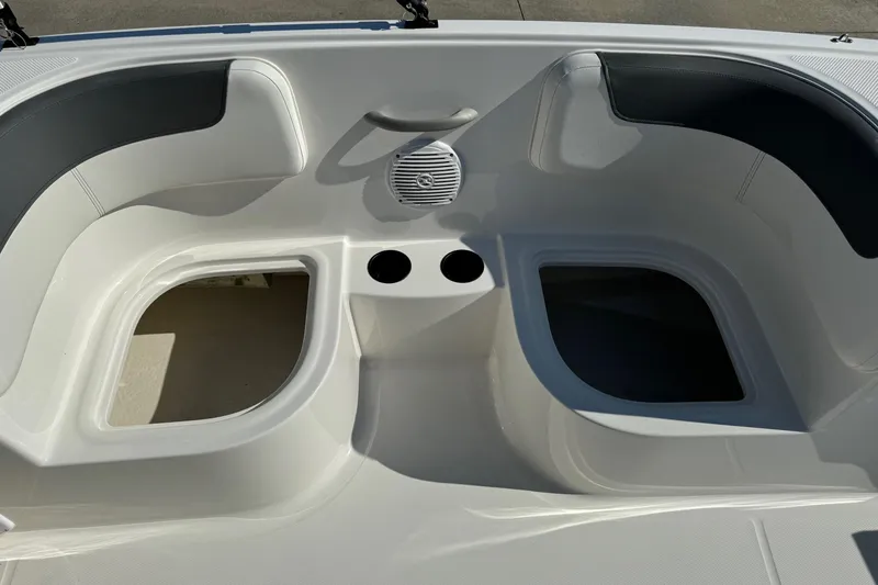Slide: The Image of 2025 Bayliner Element E16 boat interior with seating and cup holders. - 10