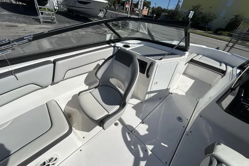 Slide: The Image of 2019 Yamaha Boats SX190 interior with gray seating and sleek design. - 12